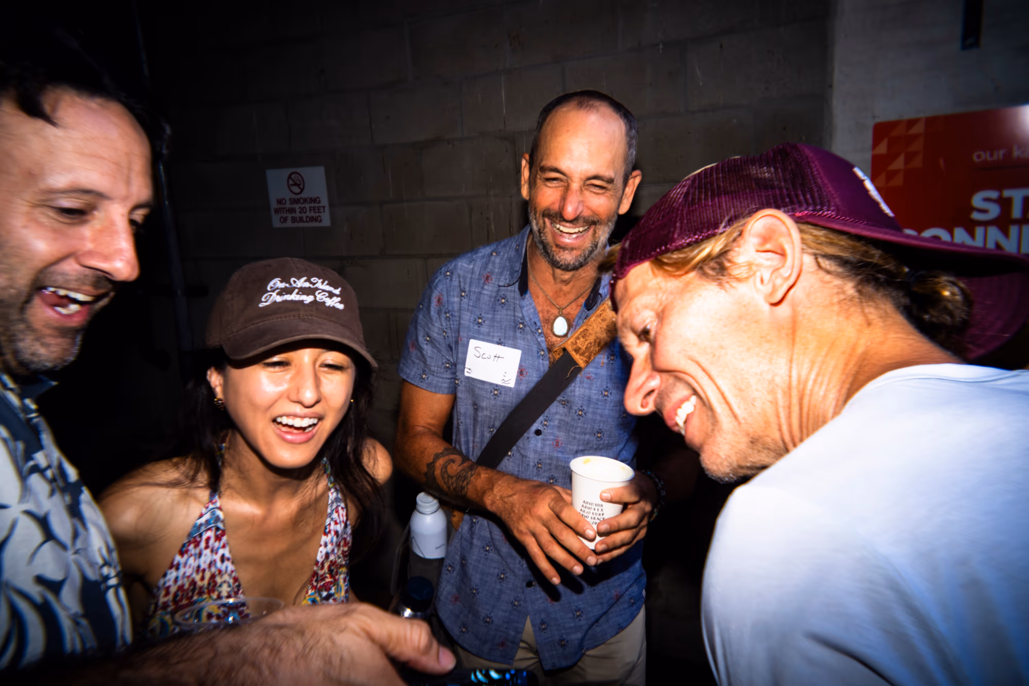 A small group shares a laugh and conversation at founder coffee.