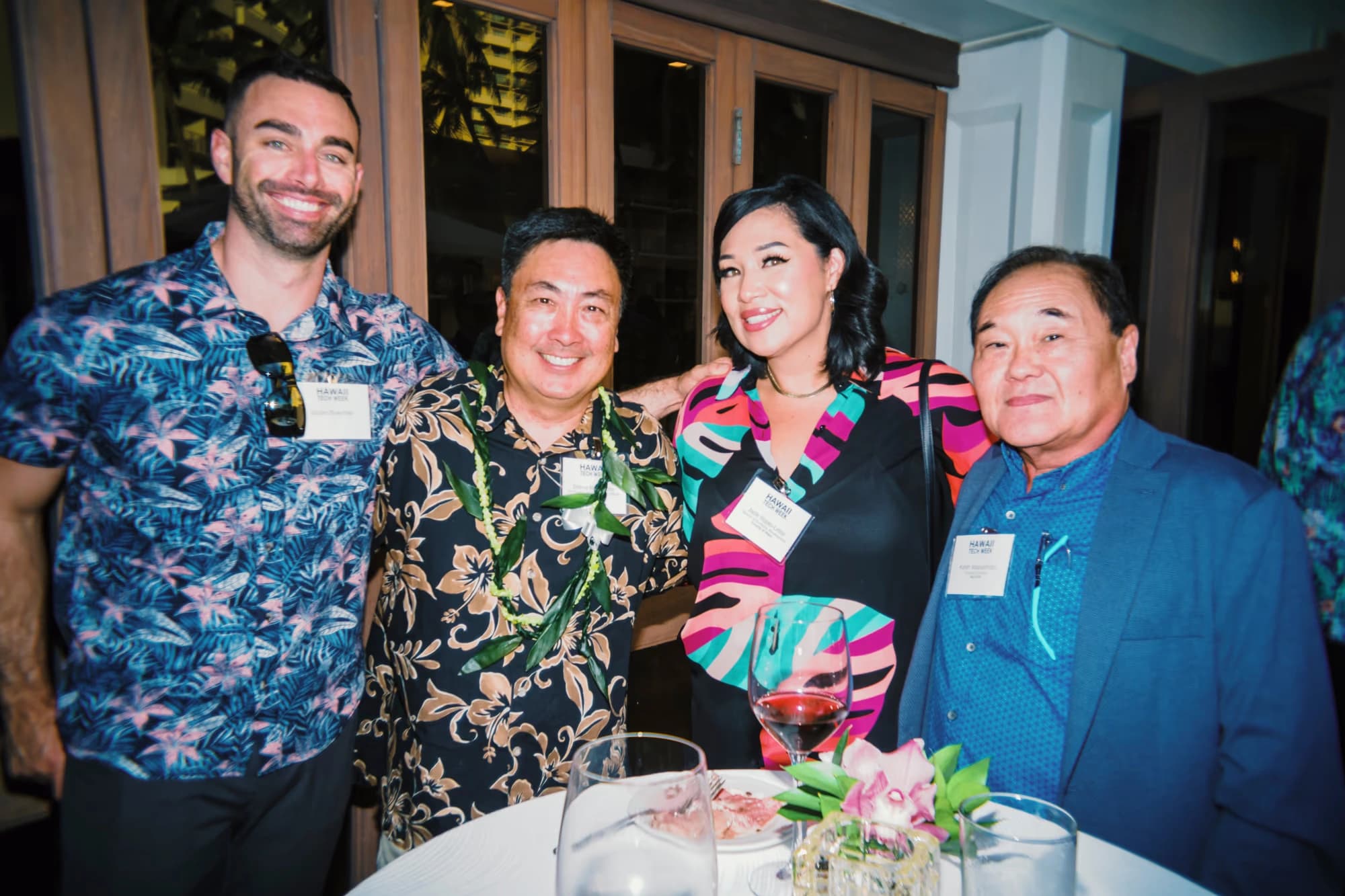 Four participants from the Maui group gather at a round table during the Executive Forum.