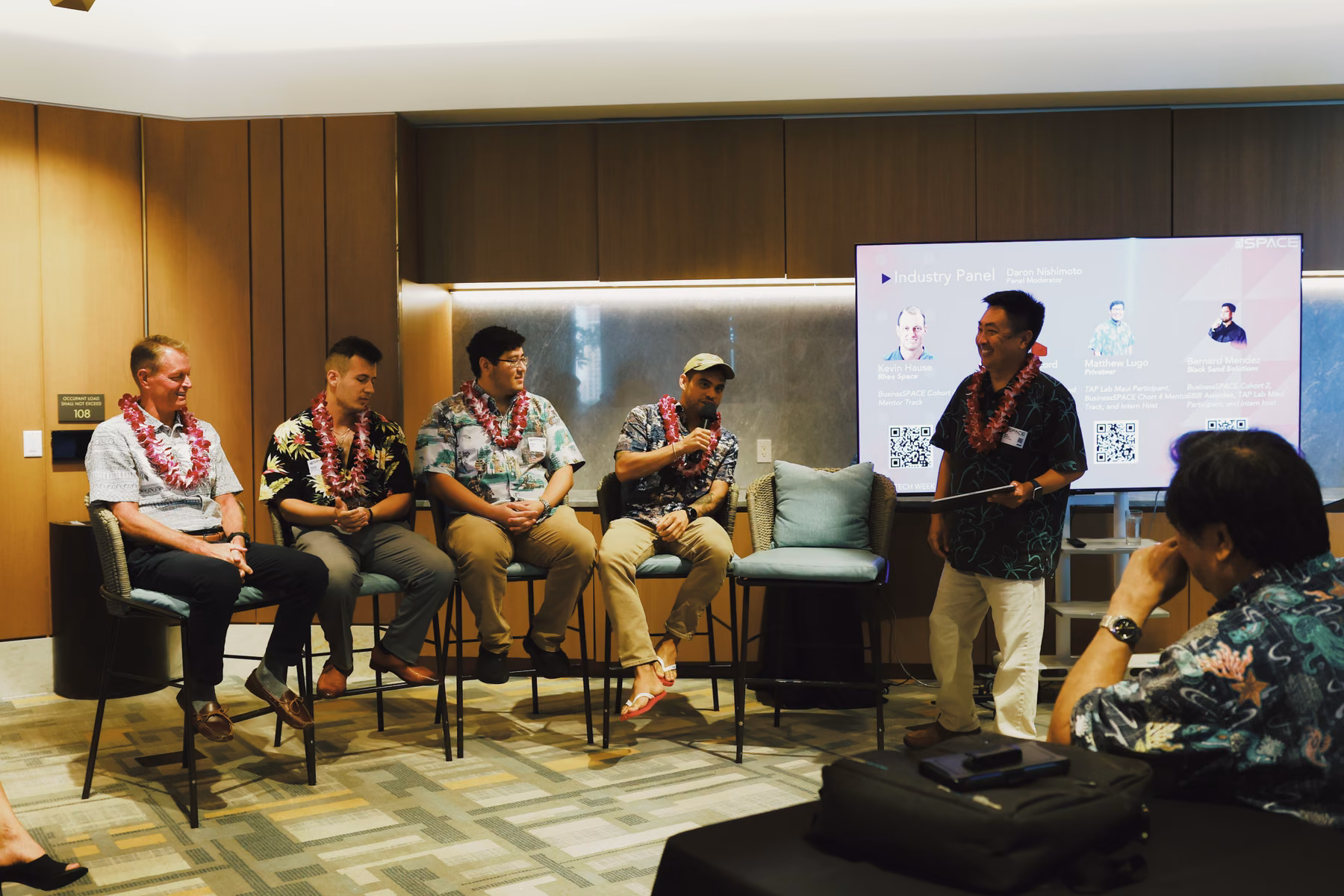 Panelists discuss Hawaii’s space industry with attendees.