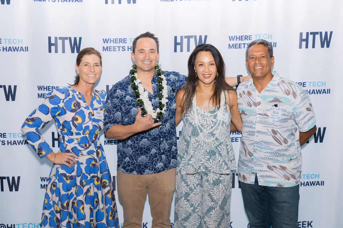 People at Hawaii Tech Week backdrop